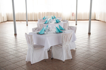 Set table with plates, glassesy, cutlery and napkins
