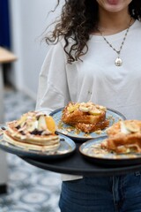 person serving pancakes