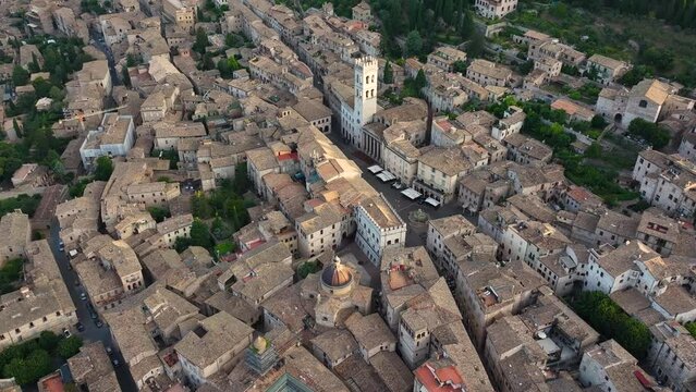 Aerial view of Assisi skyline, Piazza del Comune, Santa Maria sopra Minerva Church, summer morning light, Perugia, Umbria, Italy