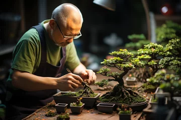 Zelfklevend Fotobehang A patient gardener nurturing vibrant bonsai trees, shaping them into miniature masterpieces. Concept of patience and horticultural art. Generative Ai. © Sebastian