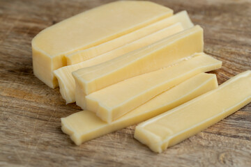 hard cheese cut into long thin slices