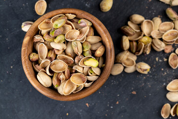 a large number of salty and crispy pistachios close-up