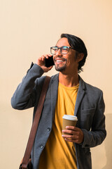 Businessman talks on the phone.