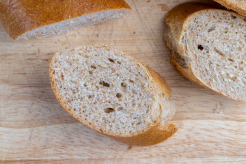 fresh wheat bread with bran on the cutting board