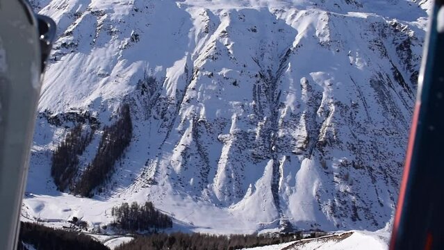 Aerial view of snowy valley in the &Ouml;tztal Alps, Tyrol, Austria. Alpine snowy winter mountain range. View from the Obergurgl-Hochgurgl Top Mountain Express gondola ski lift.