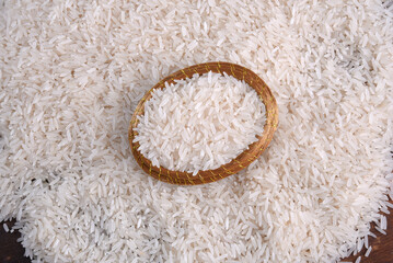 white rice natural long rice grain uncooked healthy food wooden table use texture background