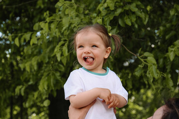 Mother with her cute daughter in park, closeup