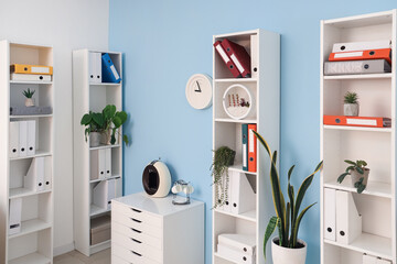 Interior of office with shelf units and document folders - obrazy, fototapety, plakaty