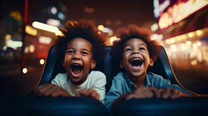 Deurstickers African American kids playing on bumper car, amusement park, enjoying with friends © Juan Gumin