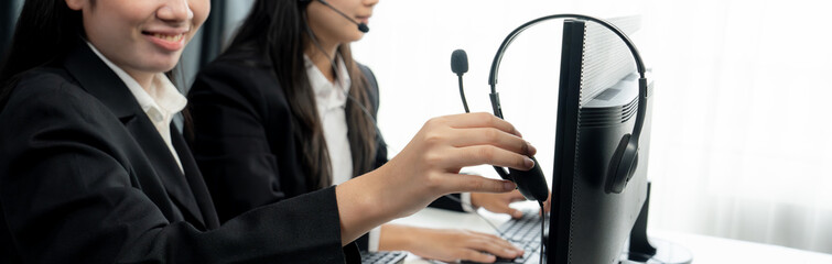 Business people wearing headset working in office to support remote customer or colleague. Call...