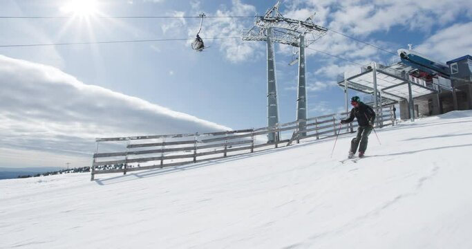 Advanced skier skiing on prepared slope. Professional ski carving. Recorded at 50fps on cinema camera.