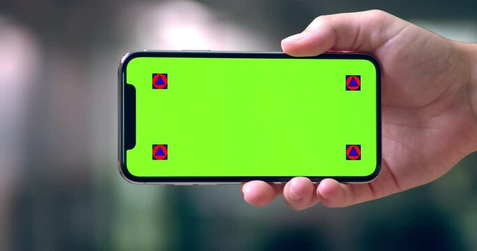 Phone, hand and green screen closeup with mockup for news, deal or forum. Smartphone, display and person show space for sign up, membership or contact us platform, service or faq, announcement or app