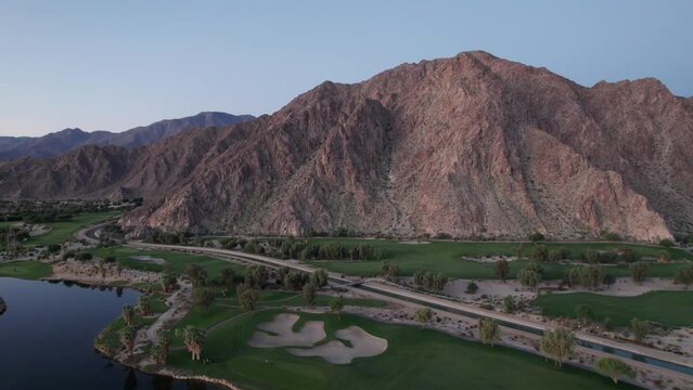 Aerial view of La Quinta mountains just before sunrise, surrounded by golf courses and resort communities