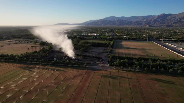 Plume of smoke travels across the Coachella Valley to the Salton Sea as a pile of mulch burns in the Empire Polo Fields