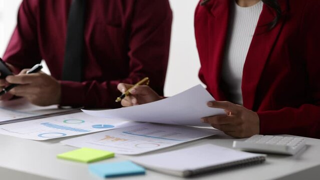 Meeting of business consultants analyzing statistical data, financial graphs and charts.