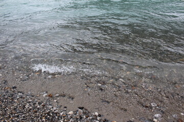 Small waves wash Mendenhall Lake beach,  Juneau, Alaska