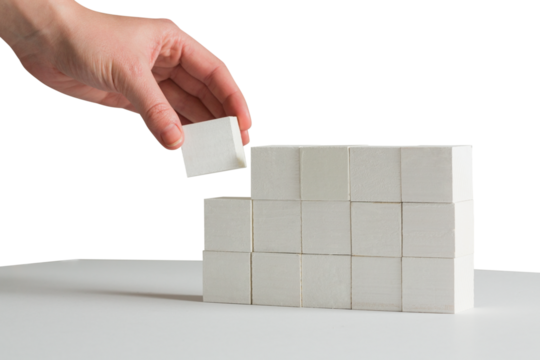 Digital png photo of hand holding brick on transparent background