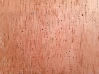 Holes in wood. wooden background. brown wood texture. rough.
