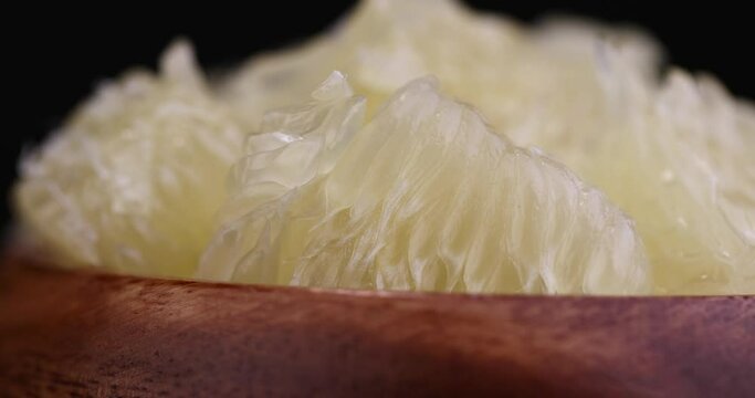 peeled pomelo on the table, cooking with ripe yellow pomelo