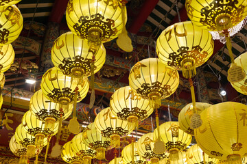 Chinese yellow lanterns are decorated during Vegetarian festival at chinese shrine, Yaowarat (Chinatown), Bangkok, Thailand. (Selective Focus)