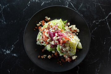 A top down view of a wedge salad.