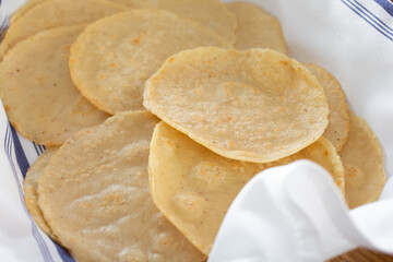 A view of a platter of hand made corn tortillas.