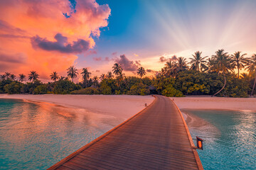Amazing sunset panorama Maldives. Luxury resort pier path seascape romantic led lights colorful sky...