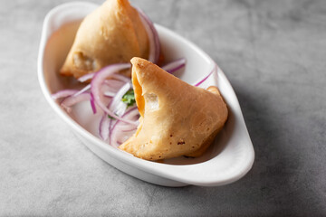 A view of a plate of samosas.