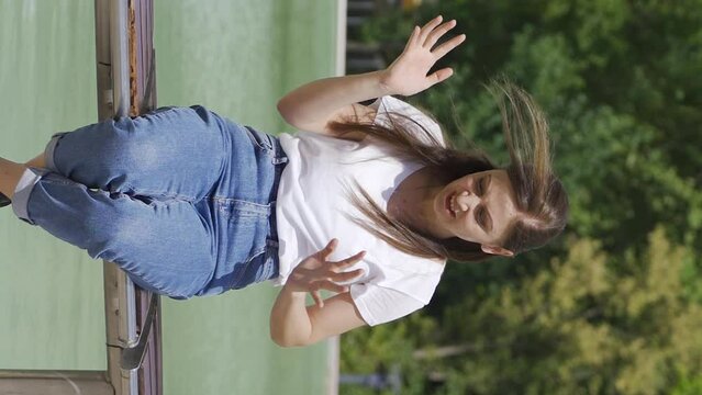 Vertical Video of Woman having a nervous breakdown slaps herself outside.
