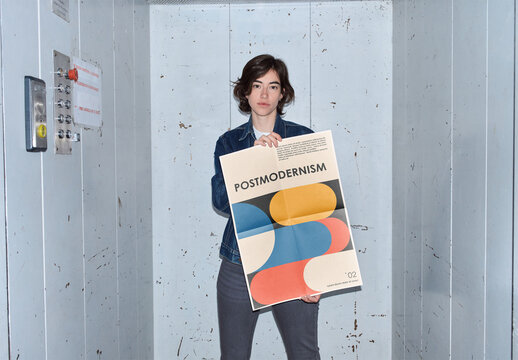 Mockup of woman holding customizable A2 vertical poster in elevator, camera flash