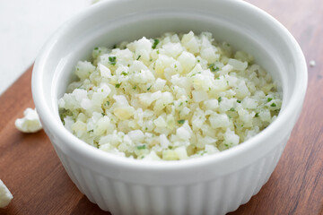 A view of a ramekin of riced cauliflower.