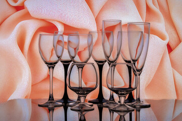 Still life with cognac glasses and wine glasses on a abstract background.