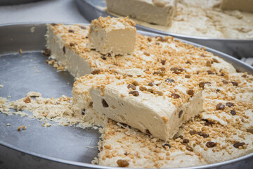 Halva with nuts on stall at bazaar. High calorie snack