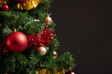 Close up of christmas tree with baubles, decorations and copy space