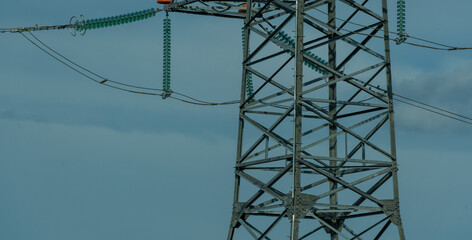 High voltage towers with sky background. Power line support with wires for electricity...
