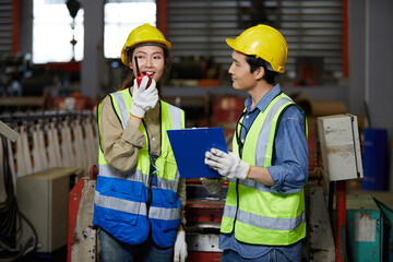 factory workers or engineers meeting and talking about work or project in the factory