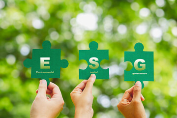 ESG concept ,Hand of human holding piece Jigsaw puzzle Sustainable development goal (SDGs) Ideas...