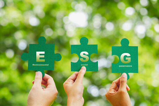 ESG concept ,Hand of human holding piece Jigsaw puzzle Sustainable development goal (SDGs) Ideas business based Global communication network