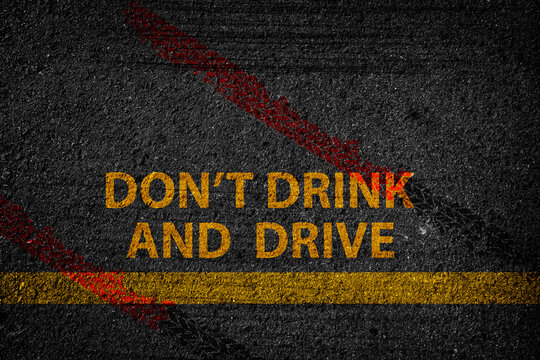 Don't Drink and Drive written on the road,Lane with the text Dont drink and drive