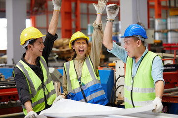 workers team raise hands up for success work or project in the factory