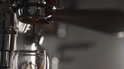 Low angle shot of pulling espresso with naked portafilter