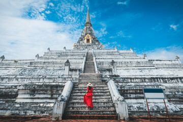 Traveler woman travel in Wat Phu Khao Thong pagoda temple at Ayutthaya historical park Thailand