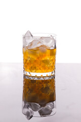 whiskey in a glass filled with ice cubes