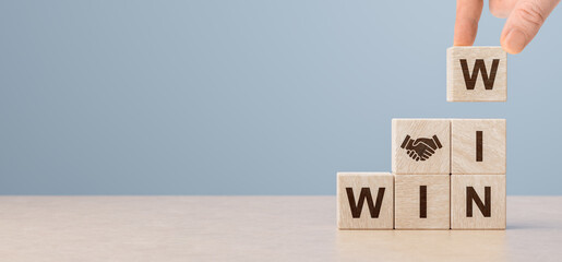 Cubes with handshake icon and win-win situation. Wooden cubes stack with text win-win situation. copy space