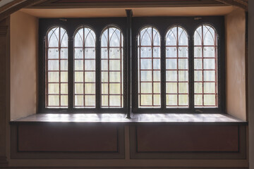 Arched windows from the inside against the light