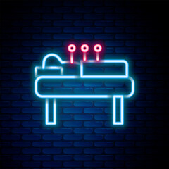 Glowing neon line Acupuncture therapy icon isolated on brick wall background. Chinese medicine. Holistic pain management treatments. Colorful outline concept. Vector