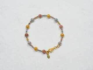 Silver bracelet display on white cloth background