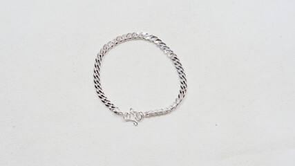 Silver bracelet display on white cloth background