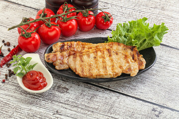 Grilled pork steak with ketchup