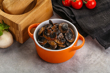 Roasted champignon mushrooms in the bowl